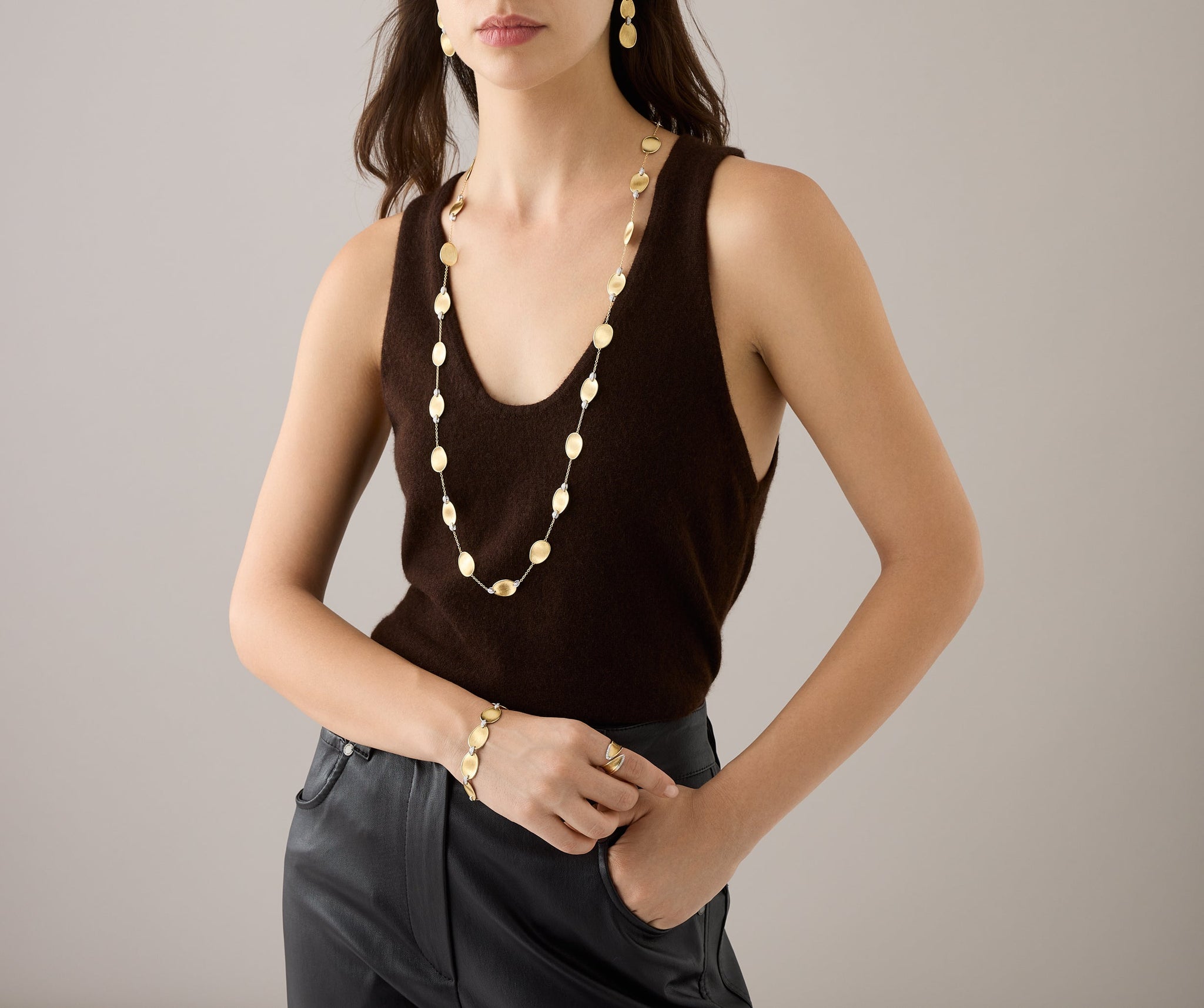 Long necklace with 18kt yellow gold leaves and diamond accents