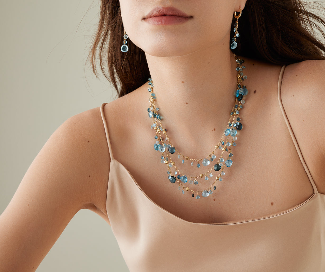 Yellow gold mixed topaz three-strand necklace