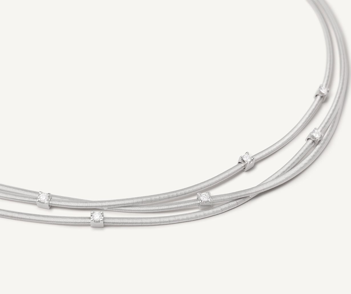 Multi-strand white gold necklace with diamonds