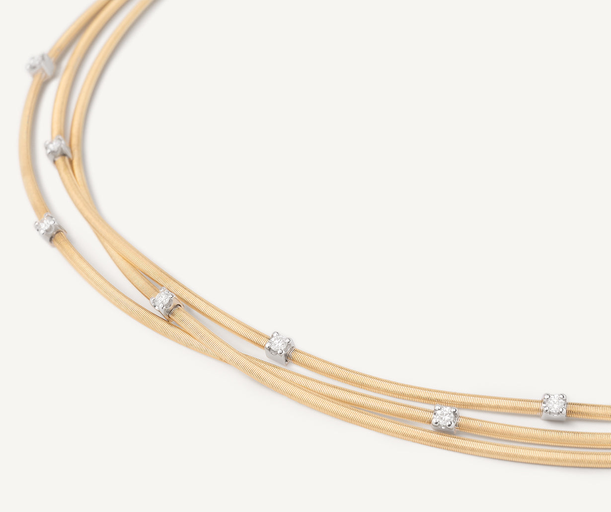 Multi-strand gold necklace with diamonds