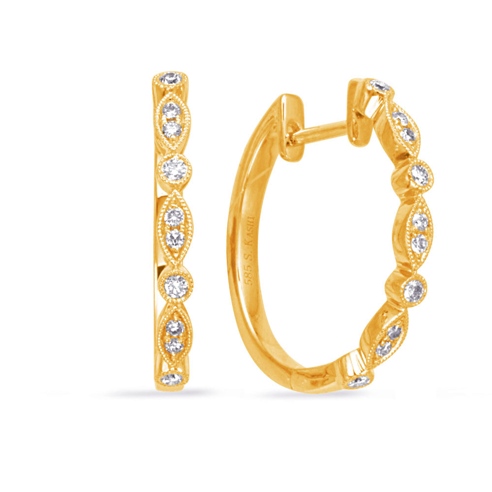 This Earring is available in 14K Yellow Gold. There are a total of 20 stones. There are Rounds with a total carat weight of 0.22 set in a Bezel Set|Prong Set setting.