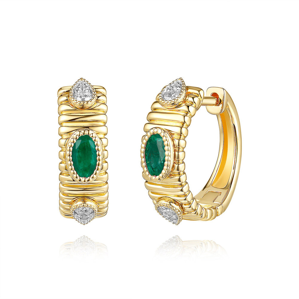 This Earring is available in 14K Yellow Gold. There are a total of 10 stones. There are Emerald with a total carat weight of 0.46 set in a Bezel Set|Micro Prong setting.There are Rounds stones with a total carat weight of 0.12 set in a Bezel Set|Micro Prong.