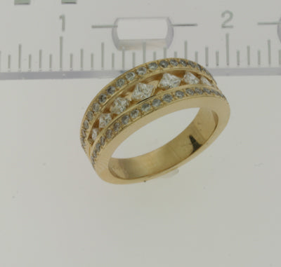 This Band is available in 14K Yellow Gold. There are a total of 54 stones. There are Princess with a total carat weight of 0.54 set in a Channel Set|Micro Pave|Micro Prong setting.There are Round stones with a total carat weight of 0.55 set in a Channel Set|Micro Pave|Micro Prong.