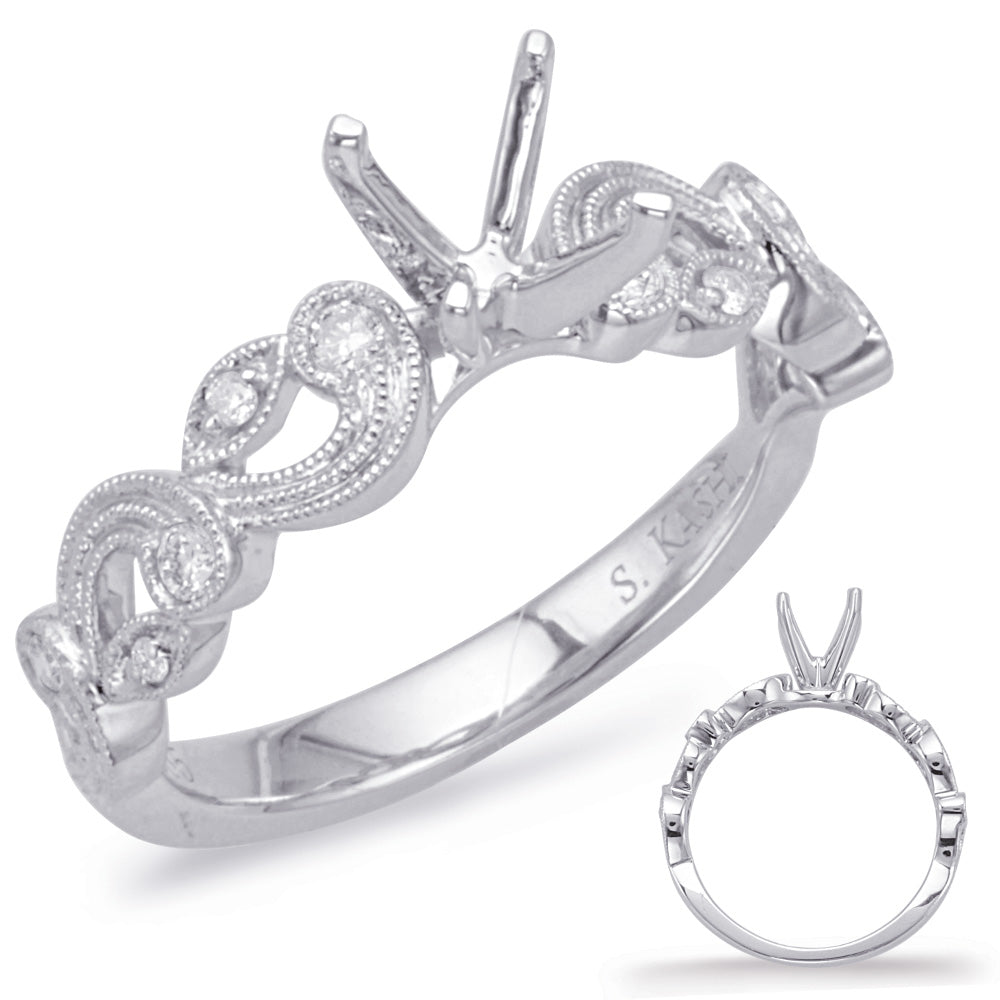 This Engagement Ring  is available in 14K White Gold. There are a total of 10 stones. There are Rounds with a total carat weight of 0.15 set in a Bezel Set|Micro Prong setting.