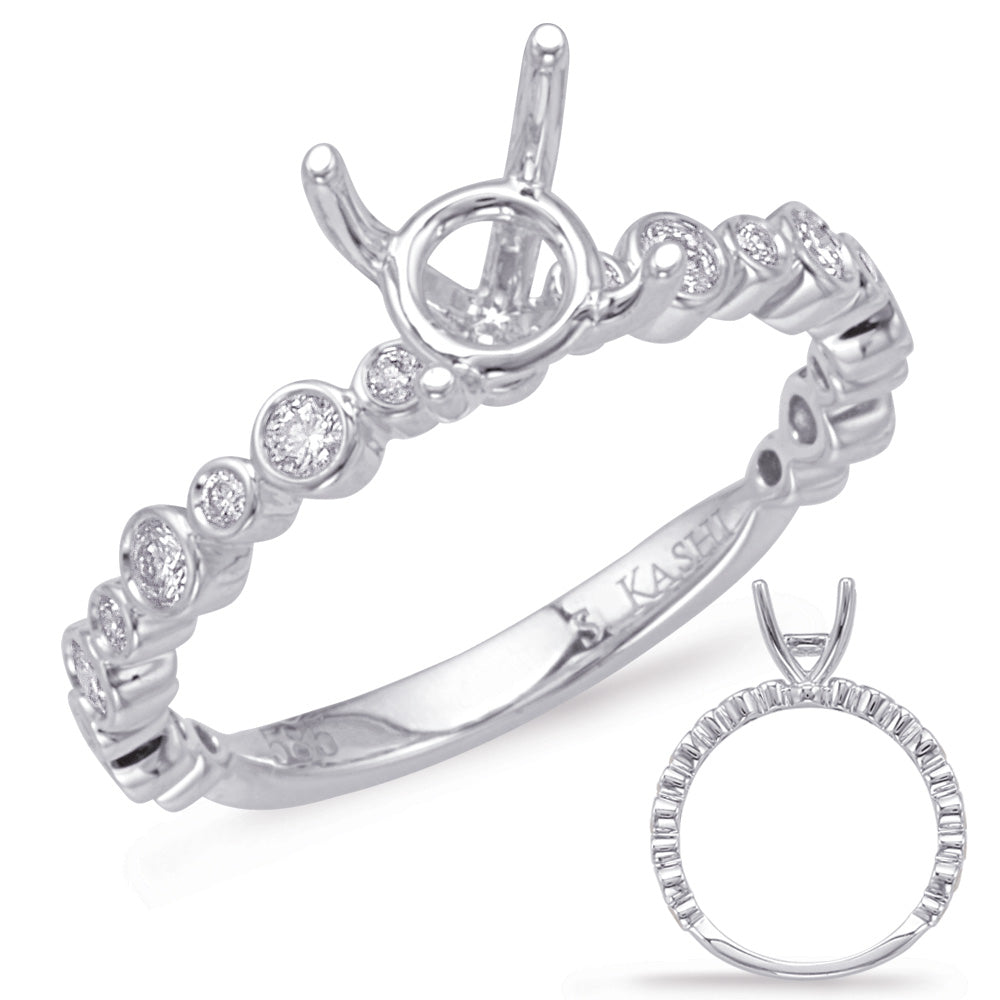 This Engagement Ring  is available in 14K White Gold. There are a total of 18 stones. There are Rounds with a total carat weight of 0.22 set in a Bezel Set setting.