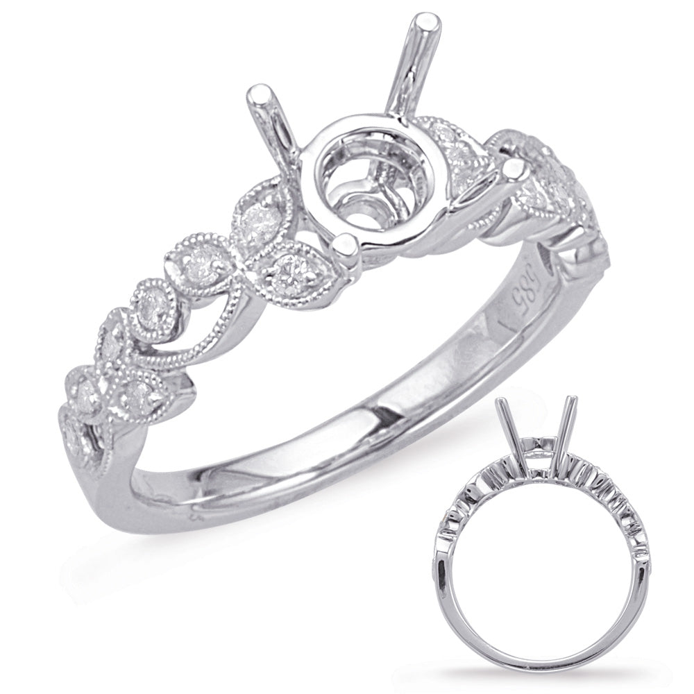 This Engagement Ring  is available in 14K White Gold. There are a total of 16 stones. There are Rounds with a total carat weight of 0.18 set in a Bezel Set|Micro Prong setting.