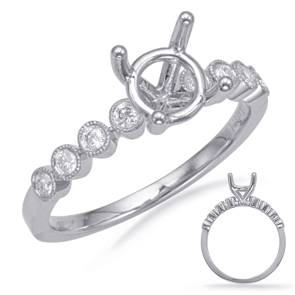 This Engagement Ring  is available in 14K White Gold. There are a total of 8 stones. There are Rounds with a total carat weight of 0.18 set in a Bezel Set setting.