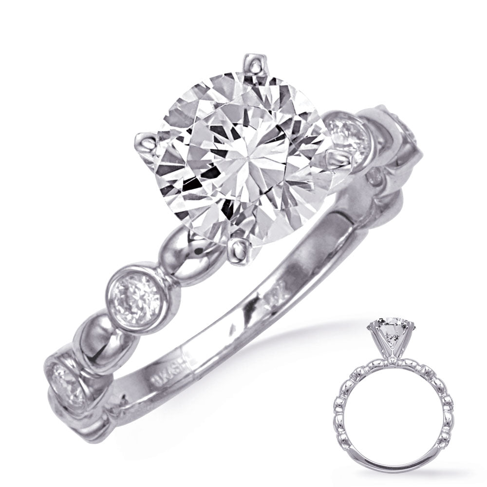 This Engagement Ring  is available in 14K White Gold. There are a total of 6 stones. There are Rounds with a total carat weight of 0.3 set in a Bezel Set setting.
