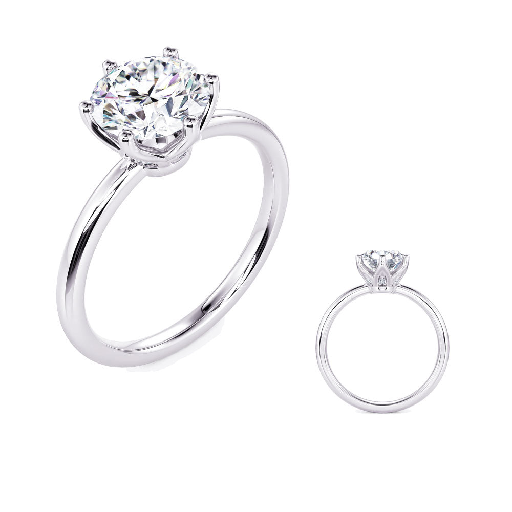 This Engagement Ring  is available in 14K White Gold. There are a total of 6 stones. There are Rounds with a total carat weight of 0.03 set in a Prong Set setting.