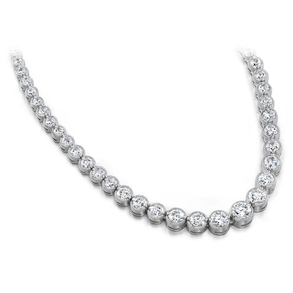 This Necklace is available in 14K White Gold. There are a total of 141 stones. There are Rounds with a total carat weight of 4.85 set in a Bezel Set setting.