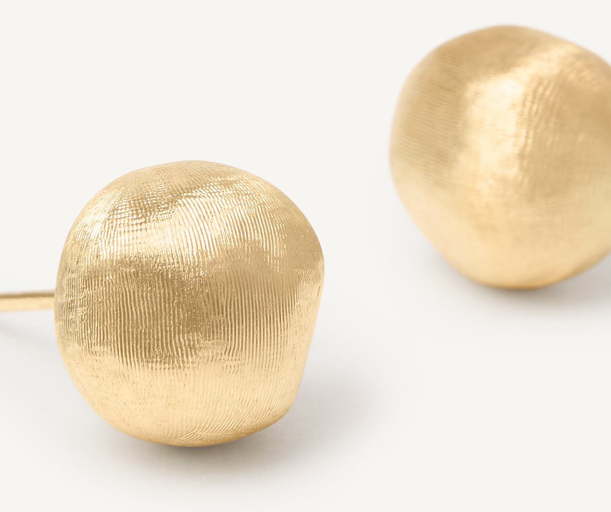 Gold stud earrings
