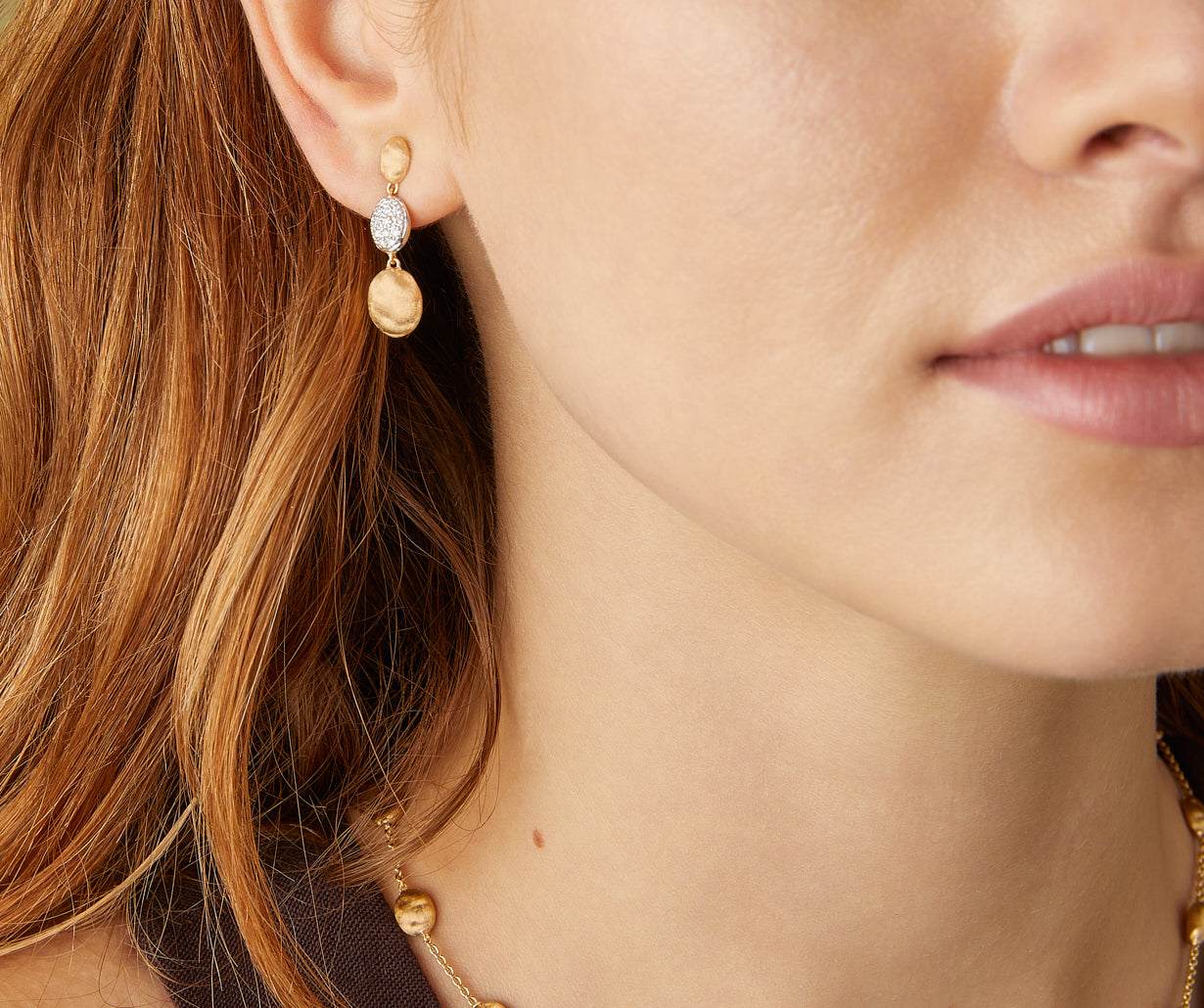Gold triple earrings with diamonds