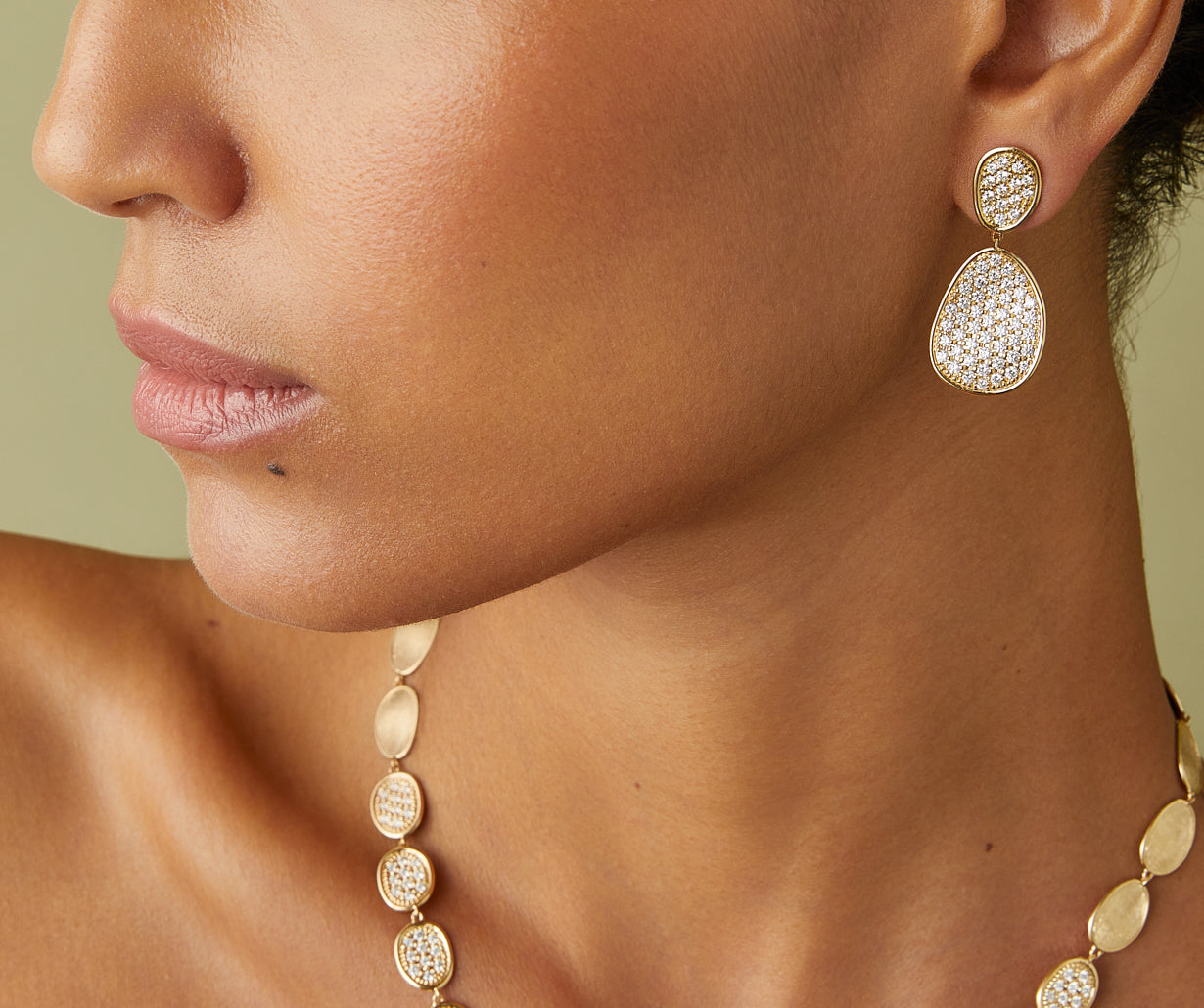 Gold chandelier earrings with diamonds