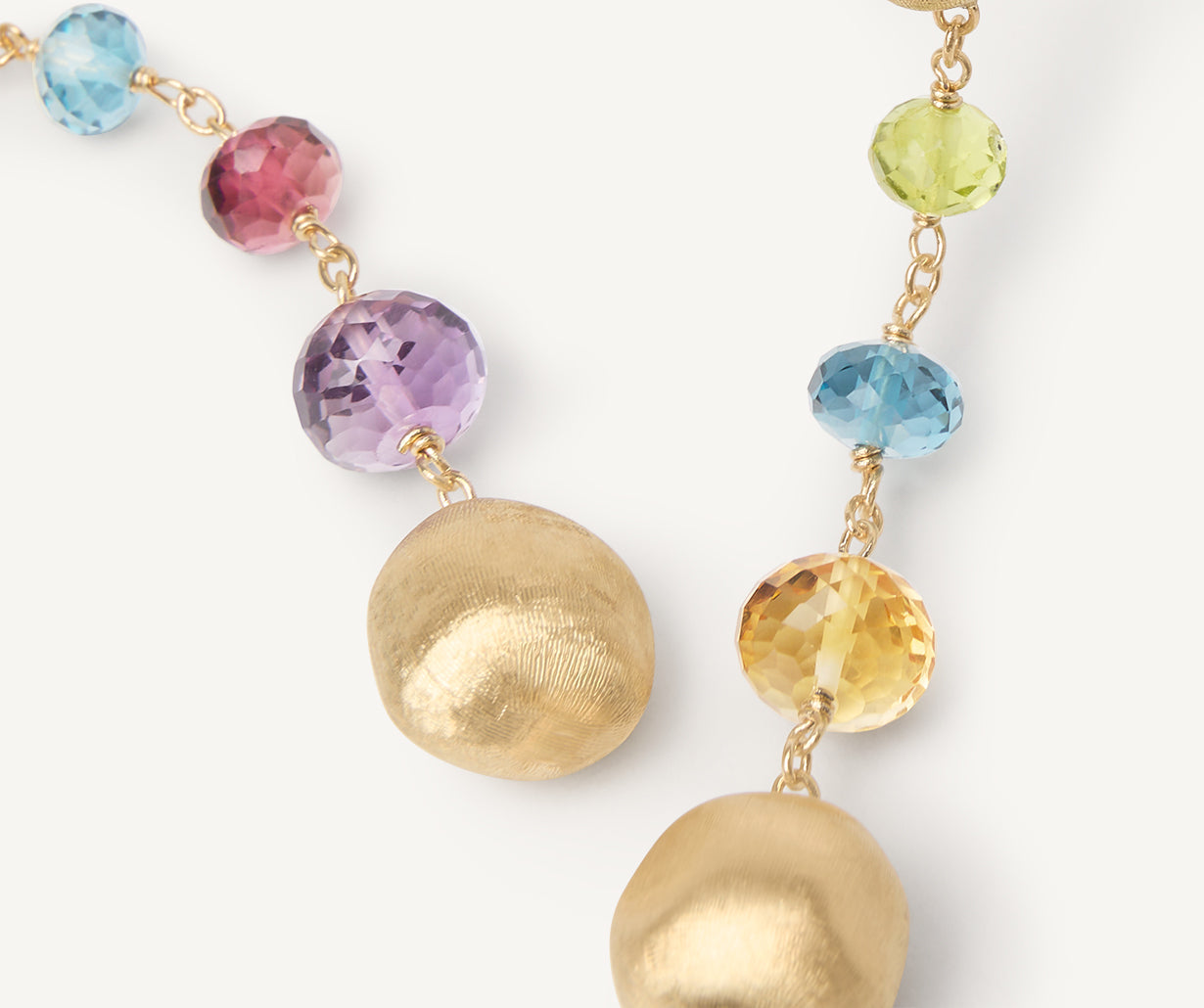 Gold duster earrings with gemstones