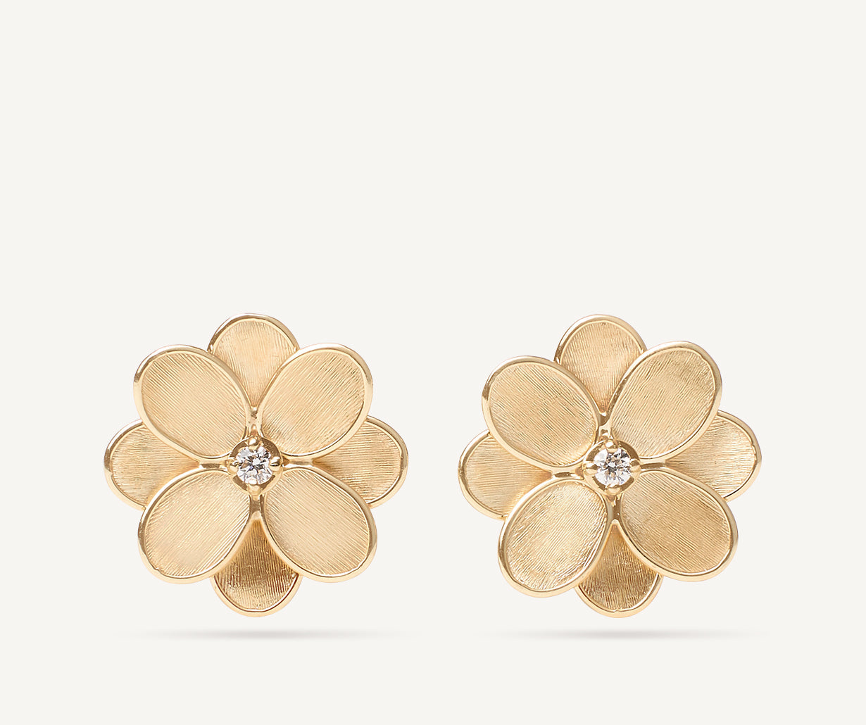 Gold stud earrings with diamonds
