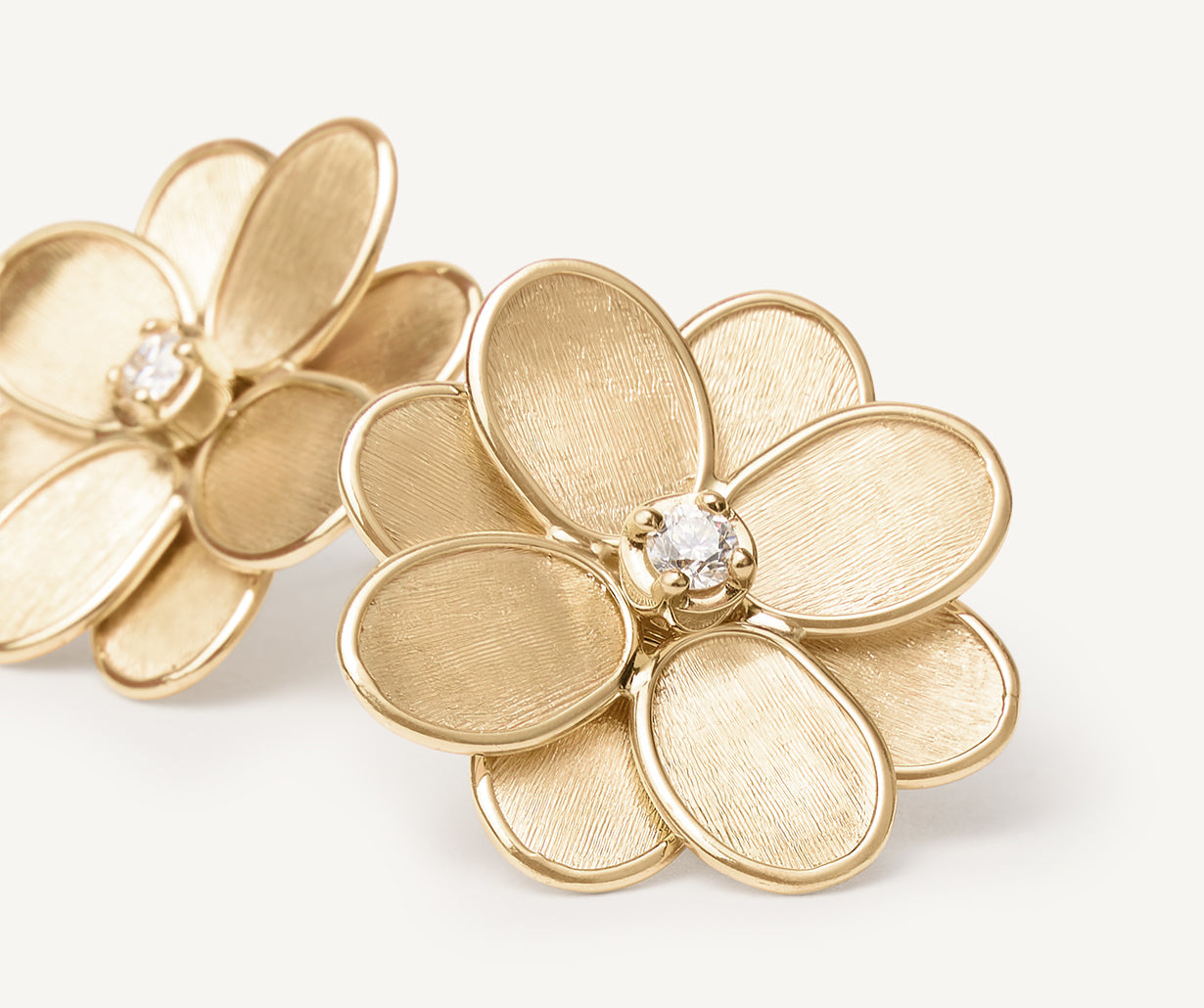 Gold stud earrings with diamonds