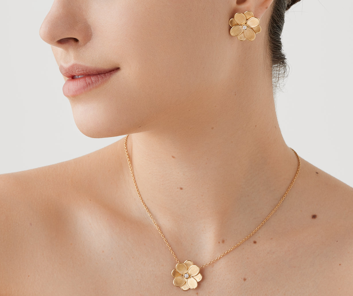 Gold stud earrings with diamonds