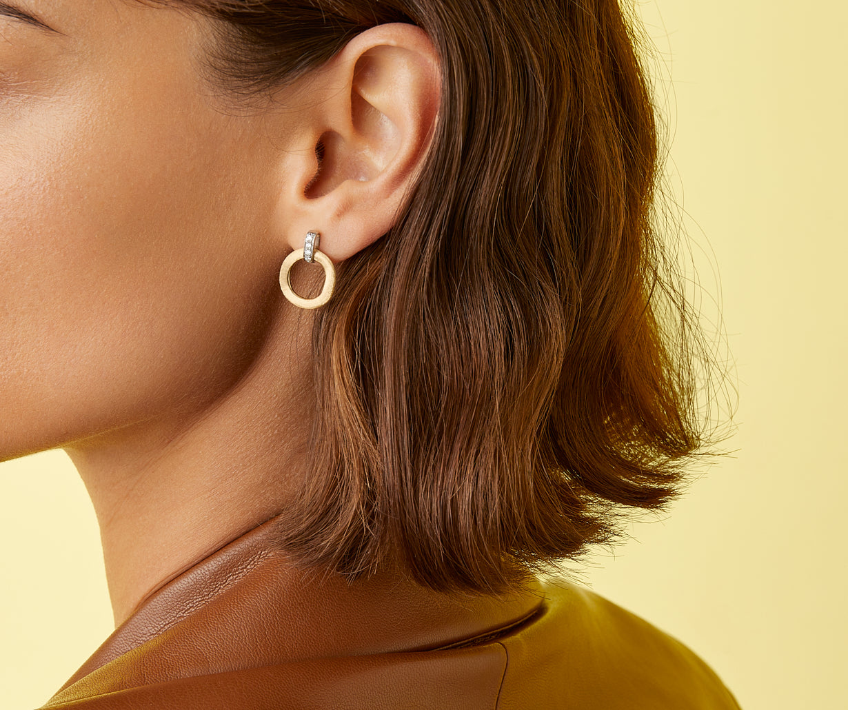 Gold stud earrings with diamonds