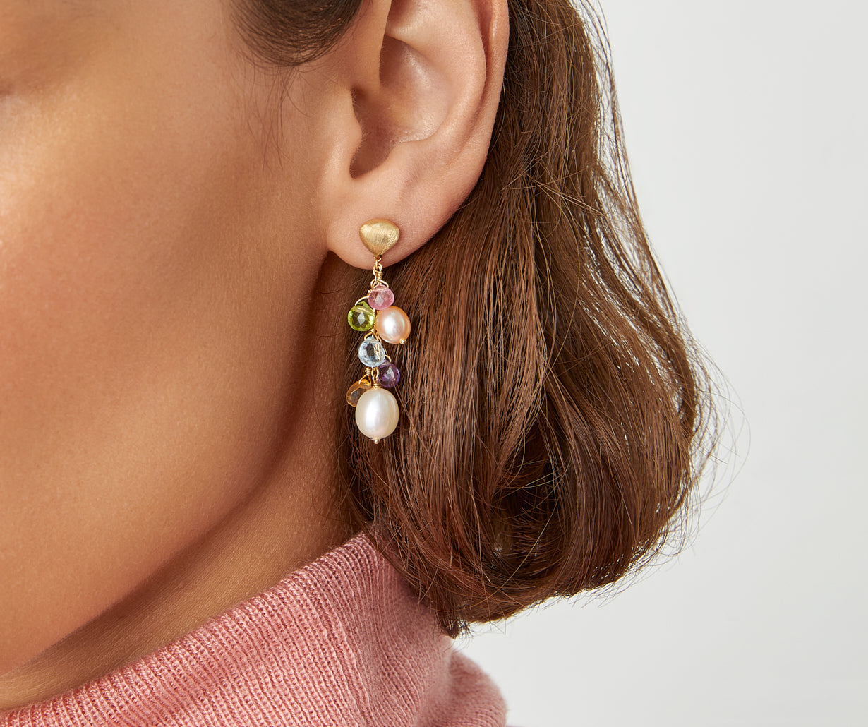 Short gold drop earrings with pearls and gemstones