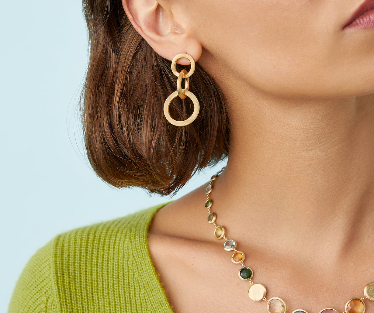 Gold chandelier earrings with three elements