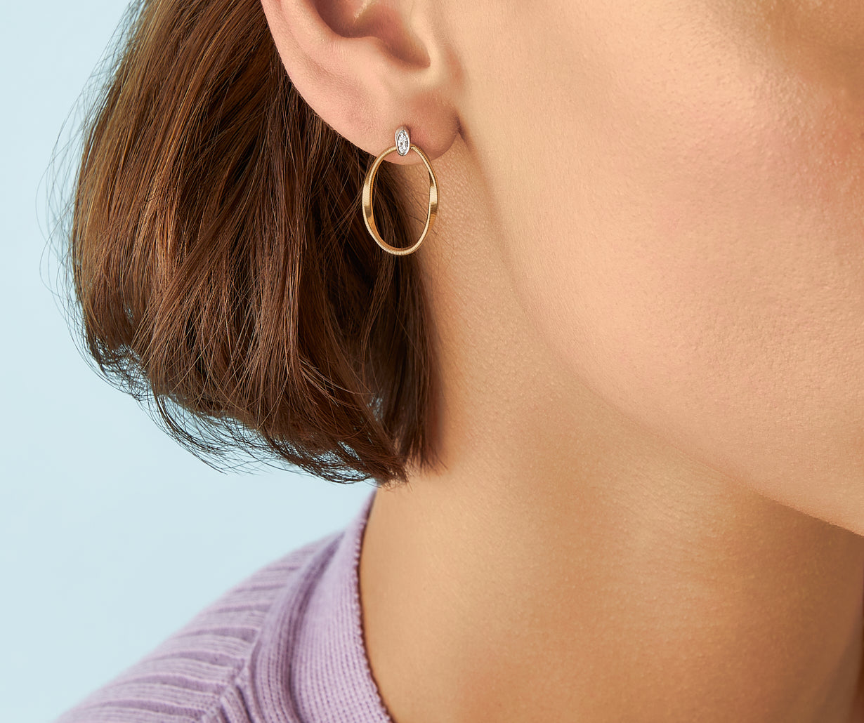 Gold stud earrings with diamonds