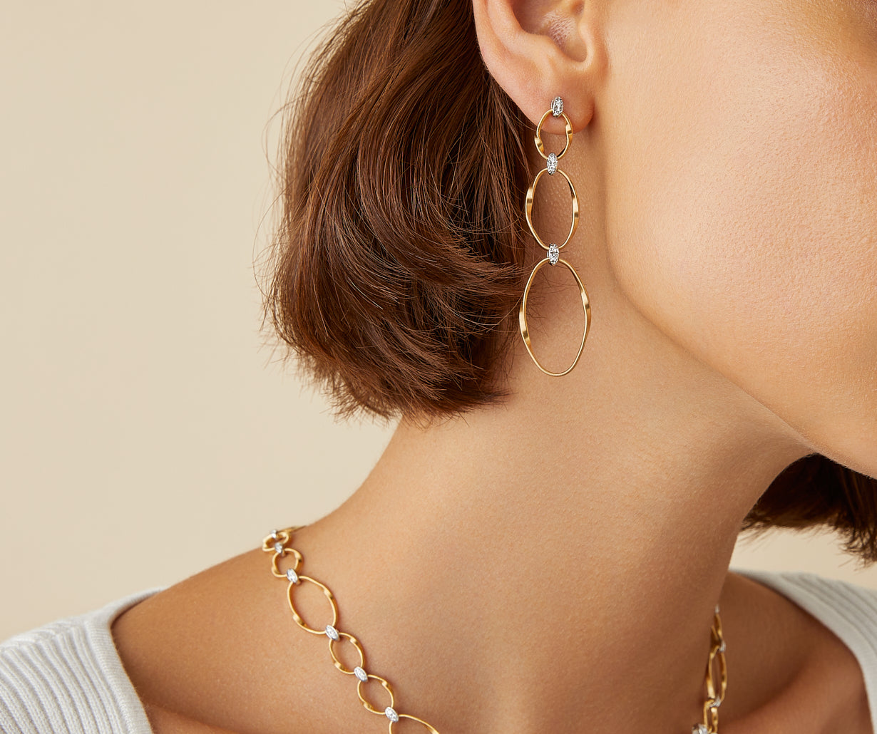 Gold diamond earrings with three elements