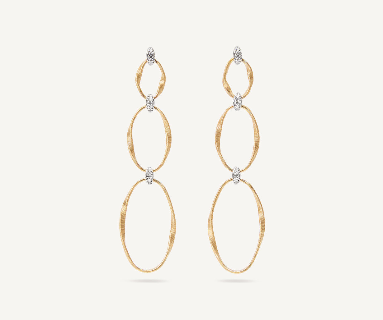 Gold diamond earrings with three elements