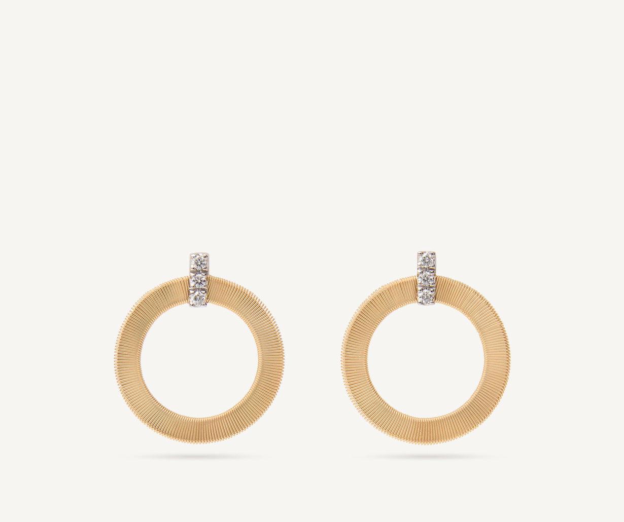 Gold stud earrings with diamonds