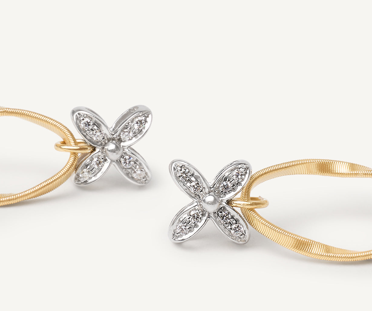 Diamond earrings with floral elements