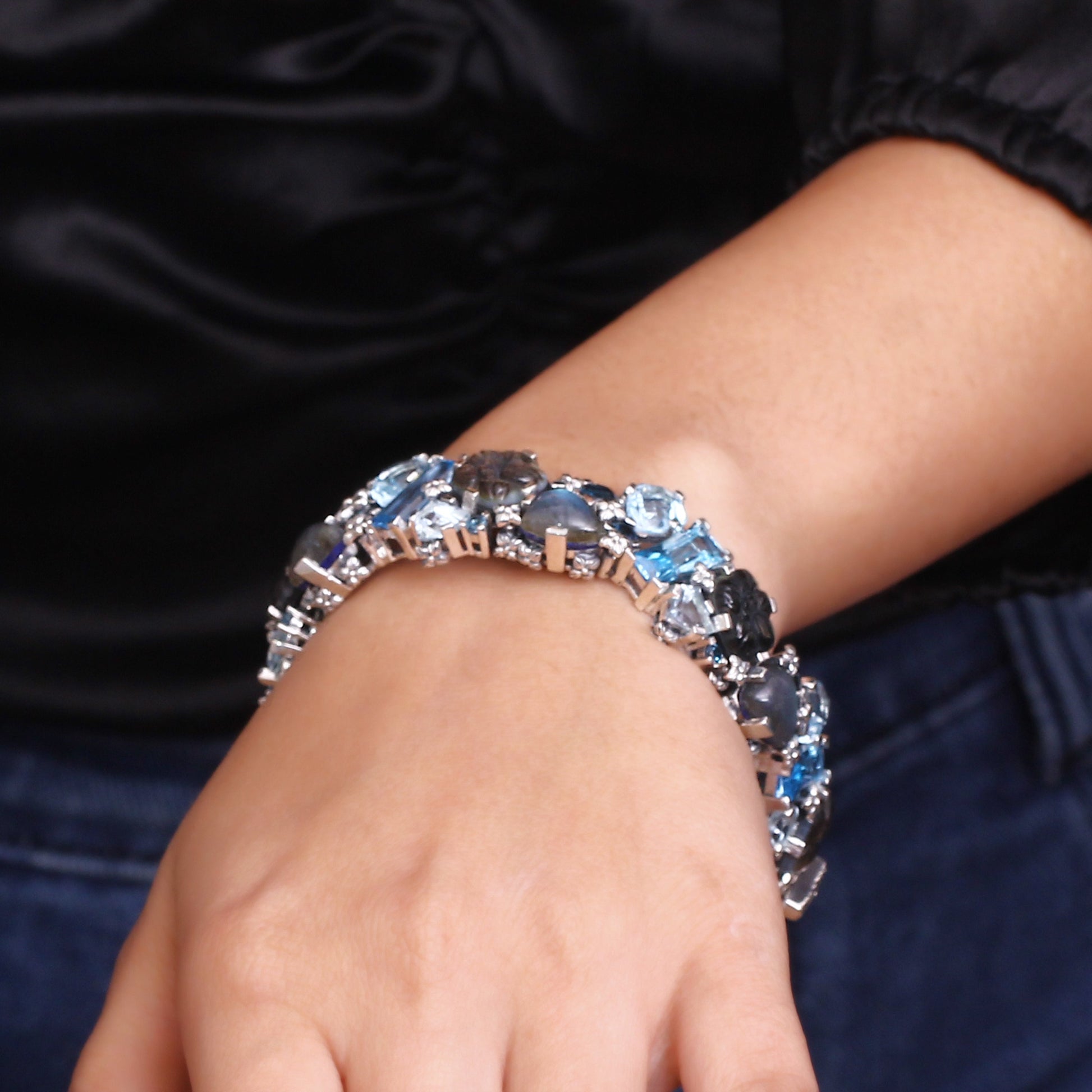 garden-of-stephen-carved-tahitian-mother-of-pearl-london-blue-topaz-swiss-blue-topaz-and-labradorite-open-and-close-bangle-in-sterling-silver