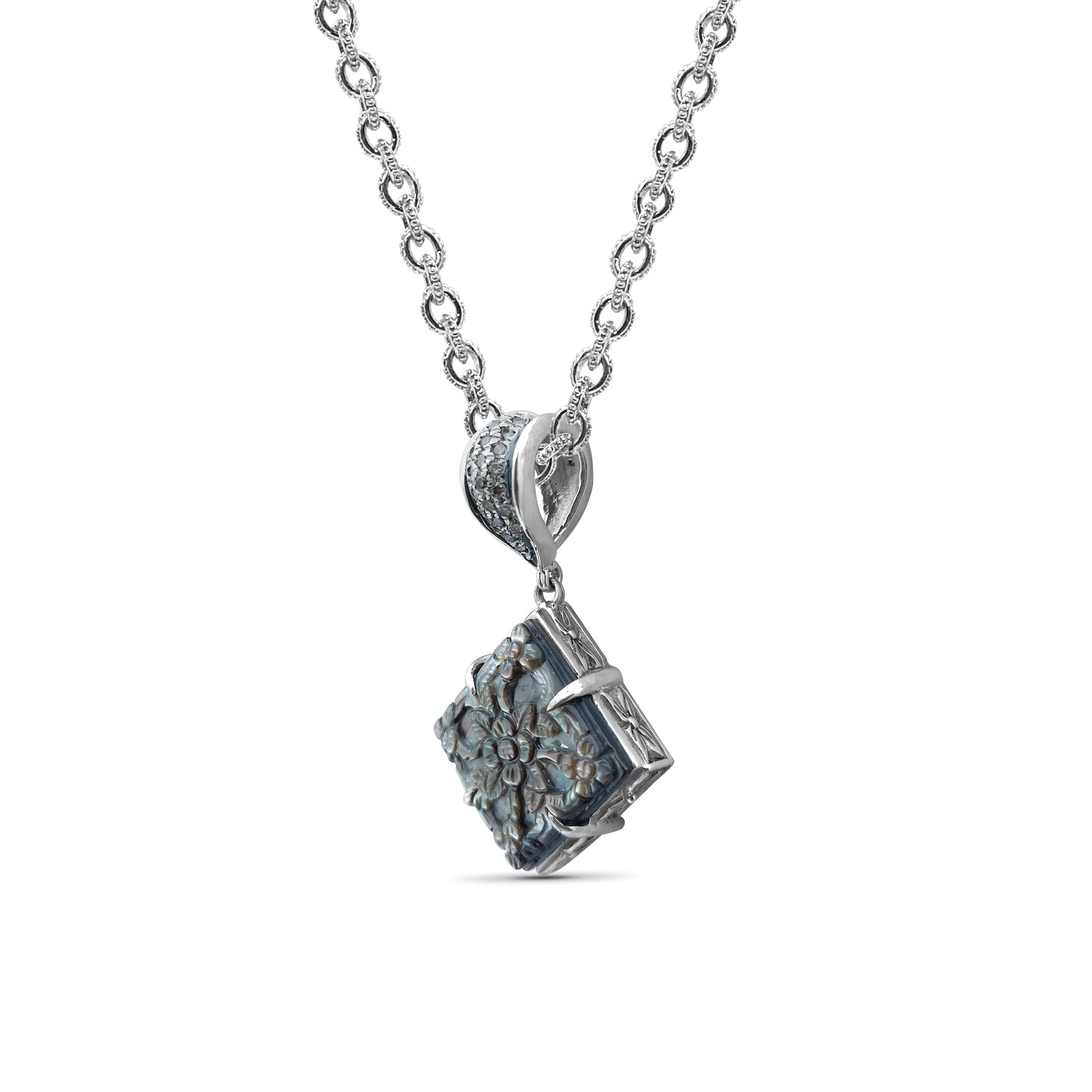 legacy-tahitian-mother-of-pearl-pendant-carving-with-0-25ct-natural-champagne-diamonds
