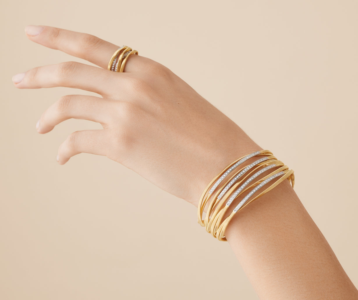 18kt yellow gold nine-strand bangle with diamond bars