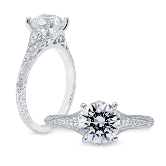 Peter Storm This elegant ring showcases a round center with a floral-inspired halo WSM372_4DiaW  WSM372_4DiaW