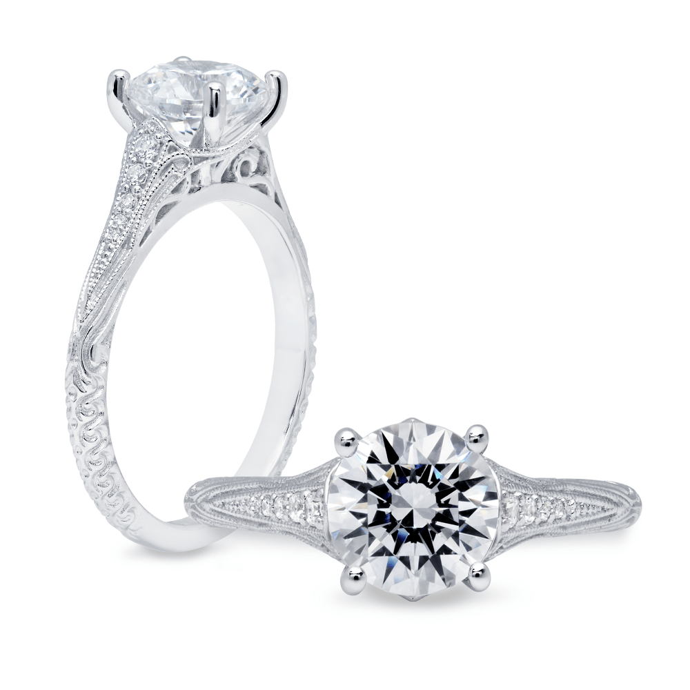 Peter Storm This elegant ring showcases a round center with a floral-inspired halo WSM372_4DiaW  WSM372_4DiaW