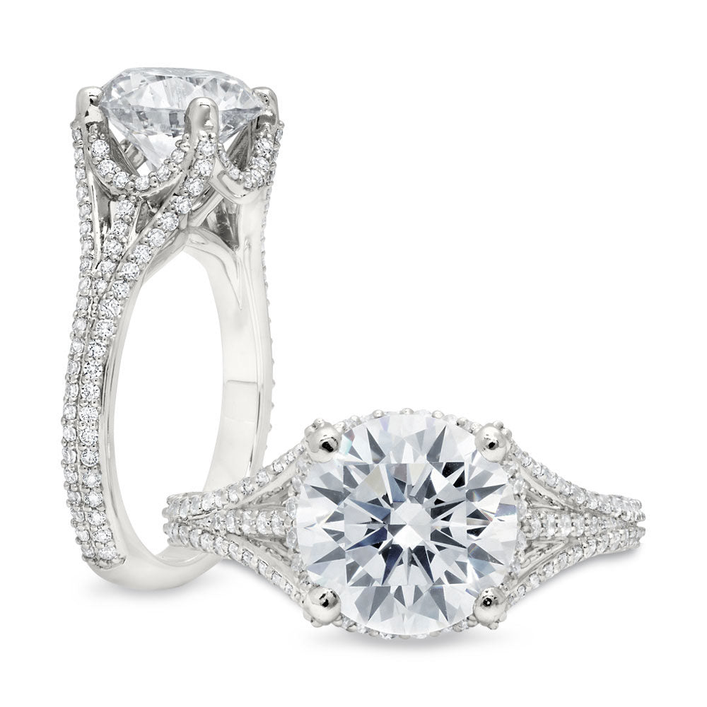 Peter Storm A striking piece, it features a large round center stone that looks as if it is floating in the basket of diamond supports surrounding the center WSM376_4DiaW  WSM376_4DiaW