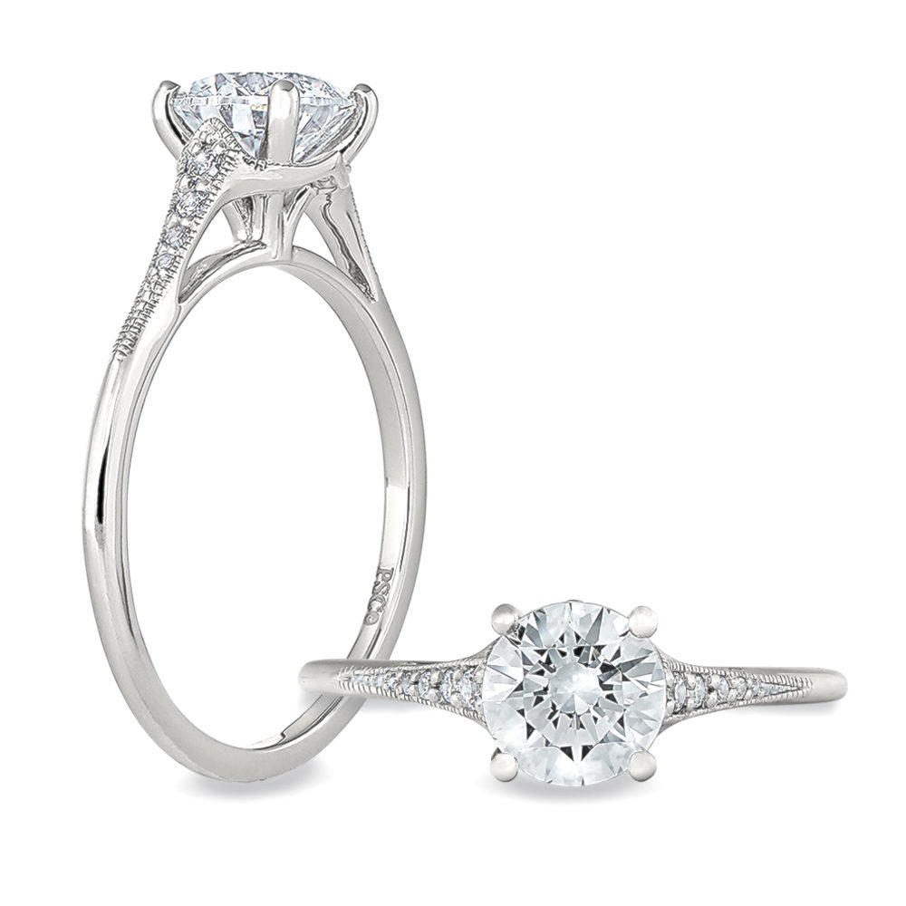 Peter Storm A simple but elegant band, it features a solitaire head with shoulders featuring 3 diamonds WSM480_4DiaW  WSM480_4DiaW