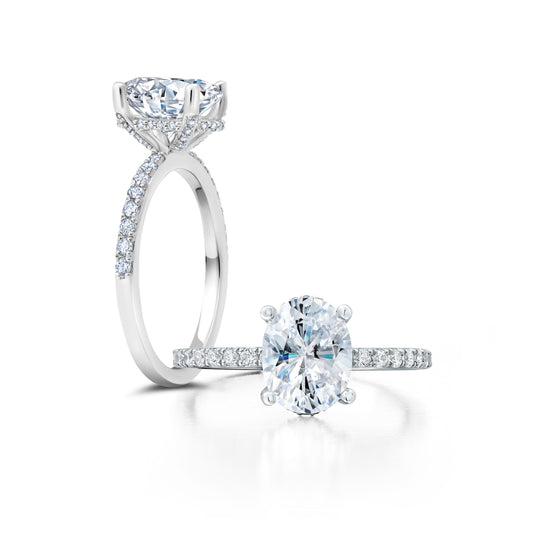This sophisticated ring showcases a dazzling round center with a classic halo setting  WSM494_4DiaW