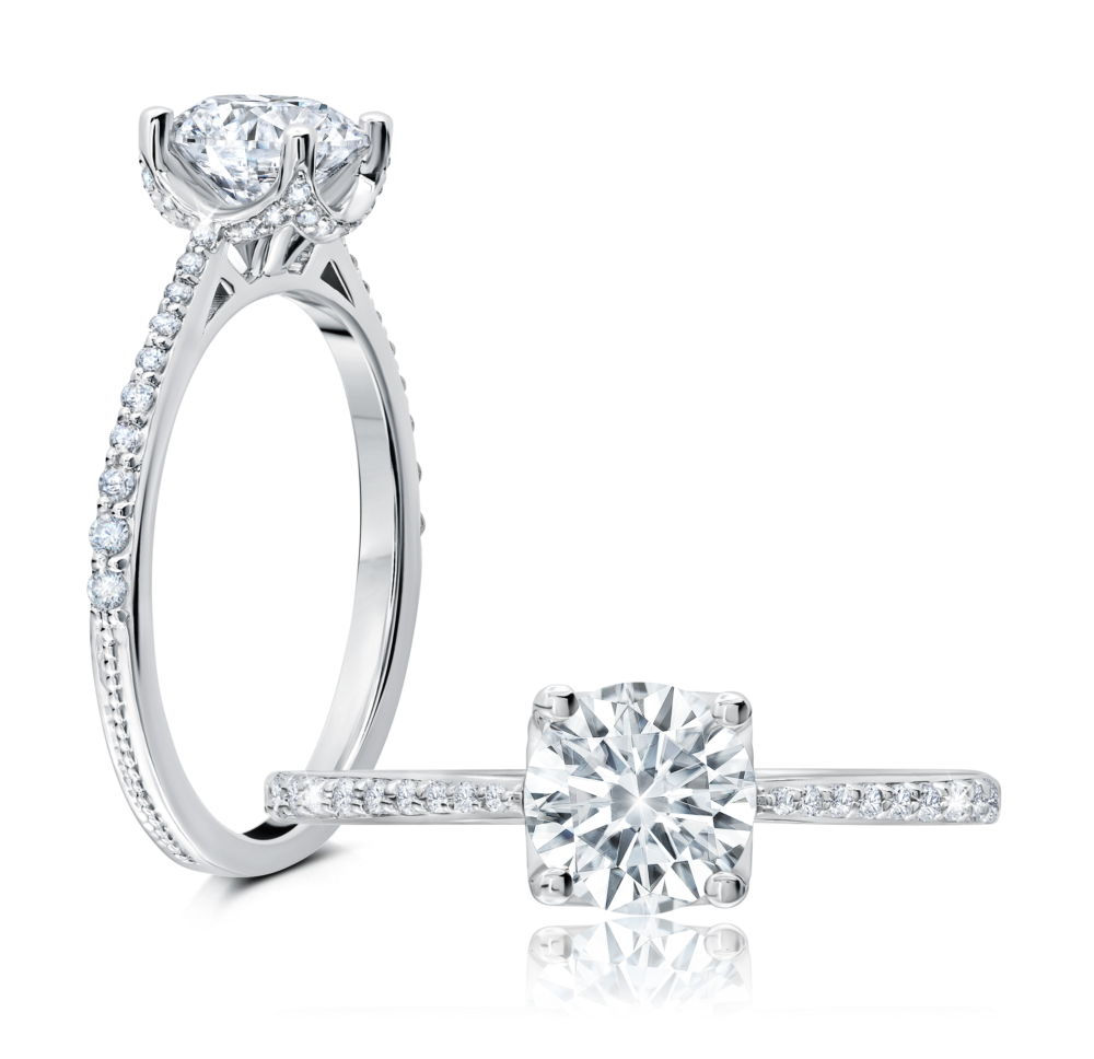 Peter Storm This elegant ring features a sculpted halo design with a radiant round center WSM570_4DiaW  WSM570_4DiaW