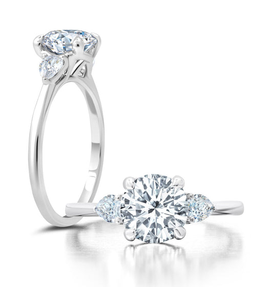 Peter Storm A classic twist on a three stone ring, this ring features two pear shape diamonds sitting on either side of your chosen center WSM585_4DiaW  WSM585_4DiaW