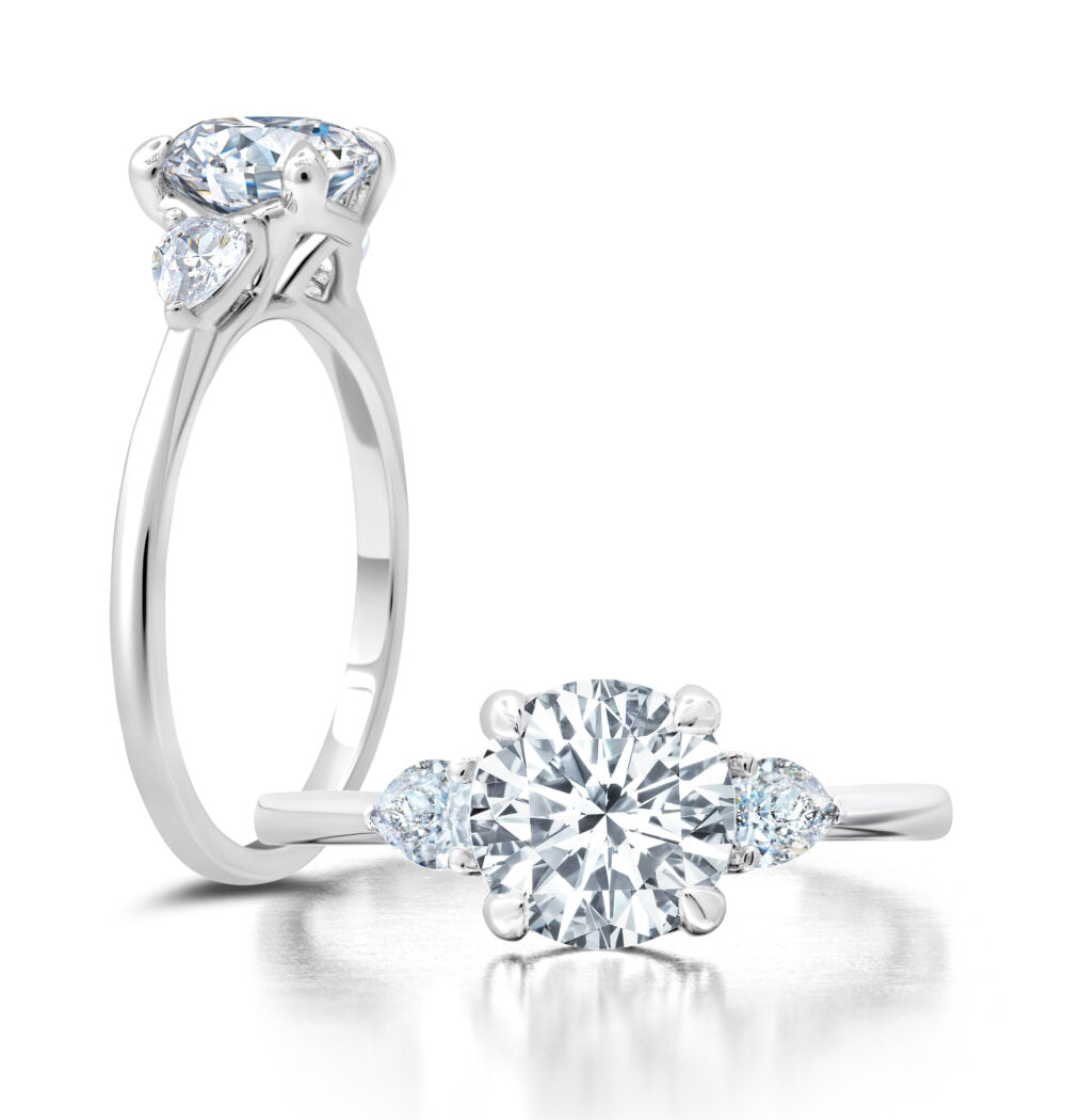 Peter Storm A classic twist on a three stone ring, this ring features two pear shape diamonds sitting on either side of your chosen center WSM585_4DiaW  WSM585_4DiaW
