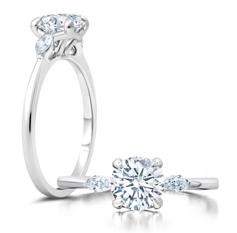 Peter Storm A classic twist on a three stone ring, this ring features two marquise diamonds sitting on either side of your chosen center WSM586_4DiaW  WSM586_4DiaW