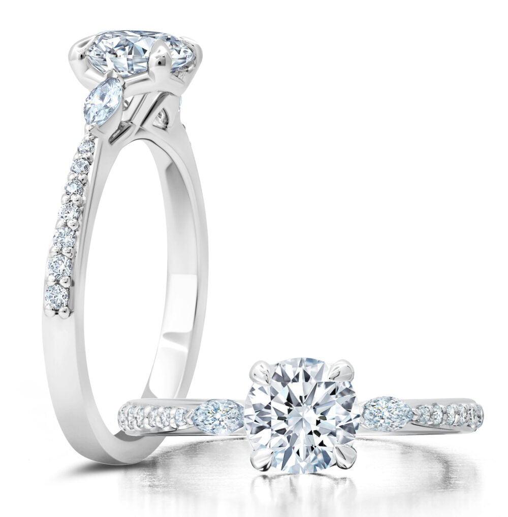 Peter Storm A classic twist on a three stone ring, this ring features two marquise diamonds sitting on either side of your chosen center WSM587_4DiaW  WSM587_4DiaW