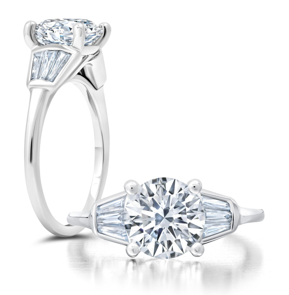 Peter Storm Dramatic, this ring has a triple of tapered baguettes that lead to a single row of diamonds down the shank WSM594_4DiaW  WSM594_4DiaW