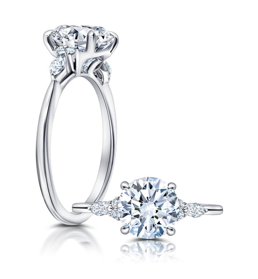 Peter Storm A classic twist on a three stone ring, this ring features two marquise and four round diamonds sitting on either side of your chosen center WSM608_4DiaW  WSM608_4DiaW