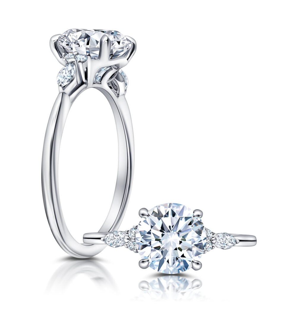 Peter Storm A classic twist on a three stone ring, this ring features two marquise and four round diamonds sitting on either side of your chosen center WSM608_4DiaW  WSM608_4DiaW