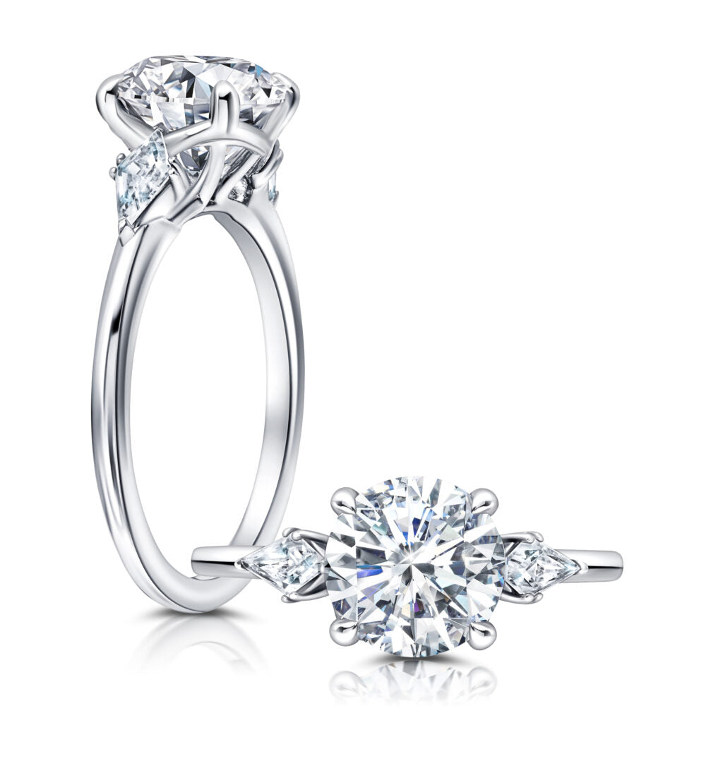 Peter Storm A classic twist on a three stone ring, this ring features two kite diamonds sitting on either side of your chosen center WSM613_4DiaW  WSM613_4DiaW