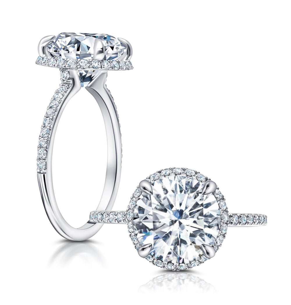 Peter Storm A classic, this flared halo features larger diamonds on the shank WSM640_4DiaW  WSM640_4DiaW