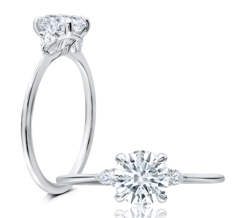 Peter Storm This playful ring features a flower-shaped halo with a brilliant round center WSM665_4DiaW   WSM665_4DiaW