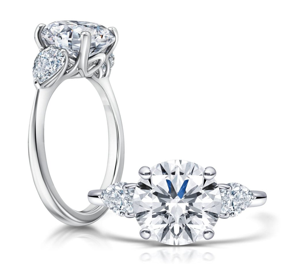 Peter Storm Peter adds a modern flair to this cluster three stone ring WSM670_4DiaW  WSM670_4DiaW