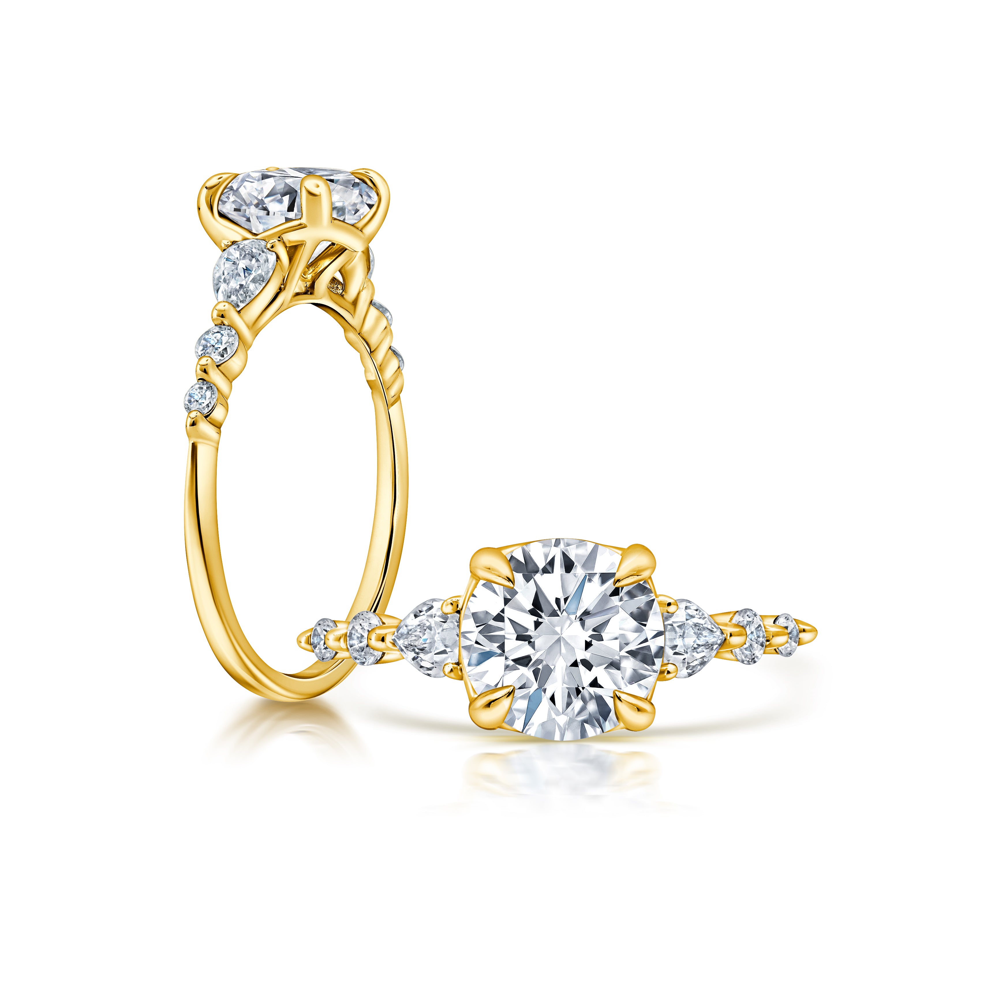 A classic twist on a three stone ring, this ring features two pear shape diamonds sitting on either side of your chosen center WSM675_4DIAW
